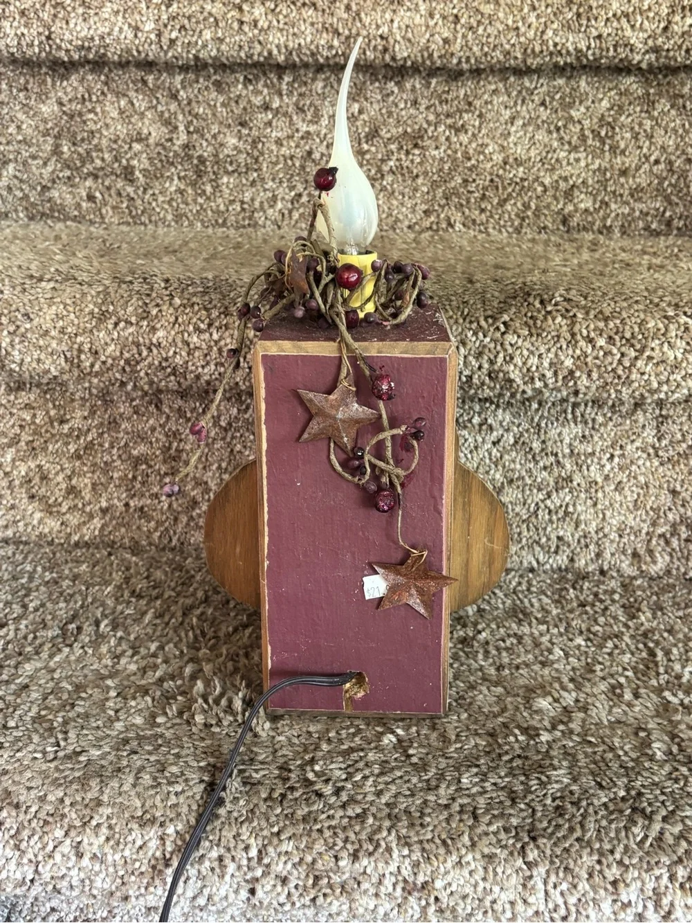 Wooden snowman with electric candle